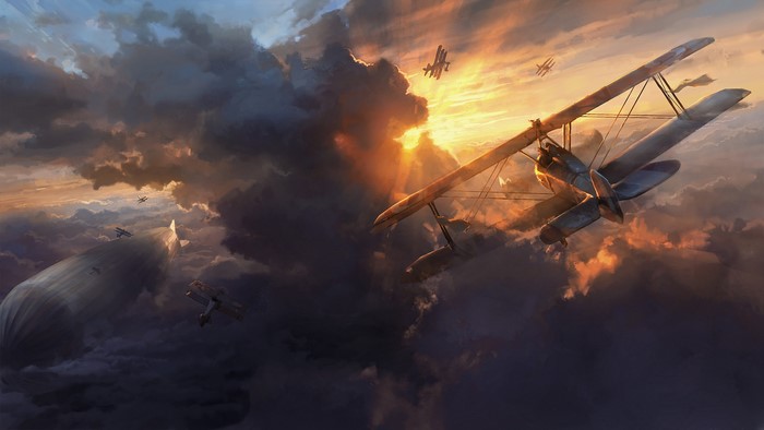 Biplanes and airship in a cloudy sky at sunset