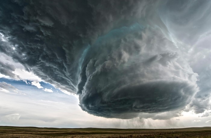 Massive storm cloud over a field
