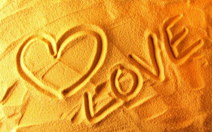 Heart and Love written in sand