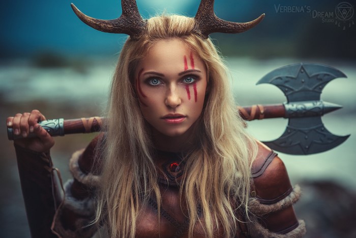 Woman in Viking costume with axe