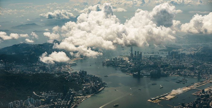 Aerial view of Hong Kong cityscape with clouds