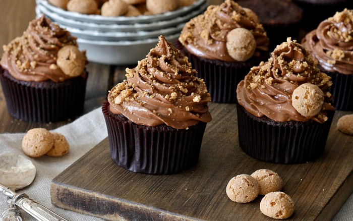 Chocolate cupcakes with frosting and cookies