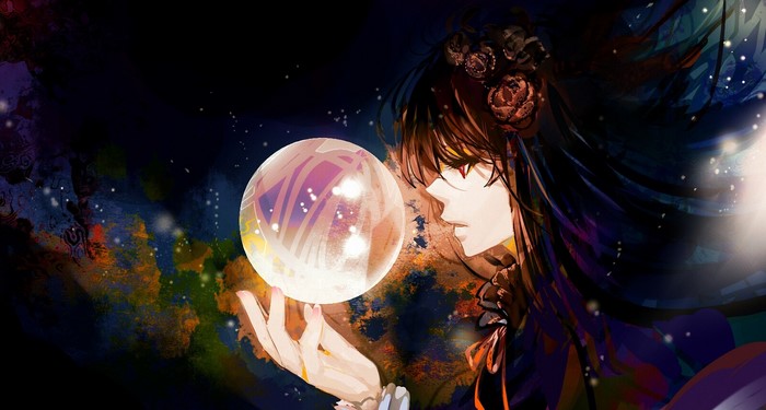 Girl with brown hair holding a magic ball