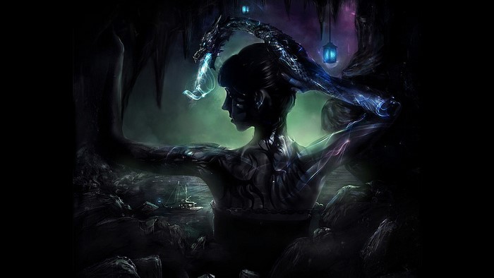 Woman with dragon in dark cave with lanterns