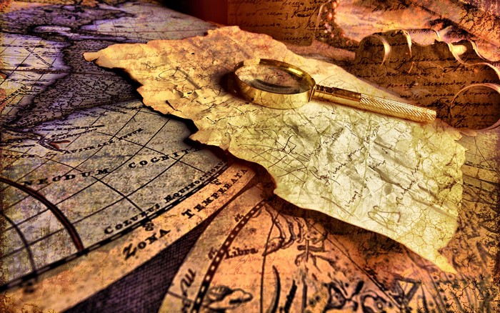 Old map with magnifying glass