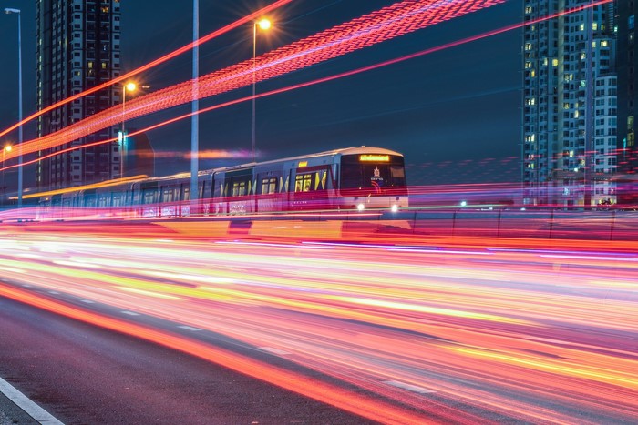 Time-lapse of a train and light trails at night