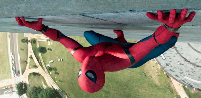 Spider-Man from Spider-Man: Homecoming hanging from a building