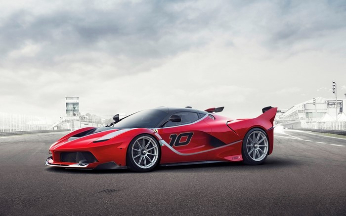 Red Ferrari FXX K with number 10 on a racetrack