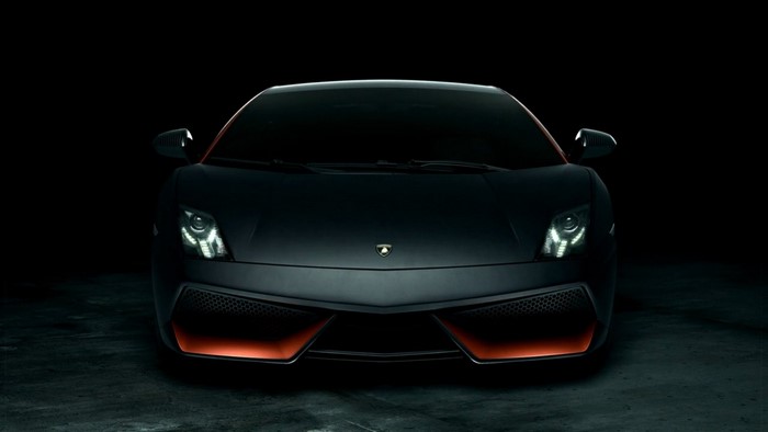 Matte black Lamborghini Aventador with orange accents