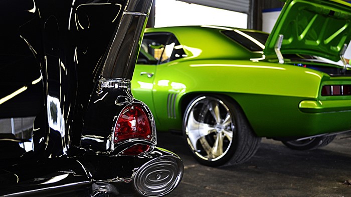 Black and green Chevrolet Camaros