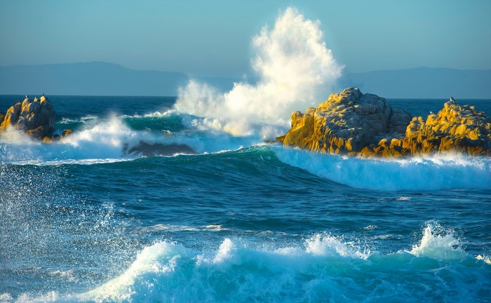 Waves crashing on rocks in the ocean