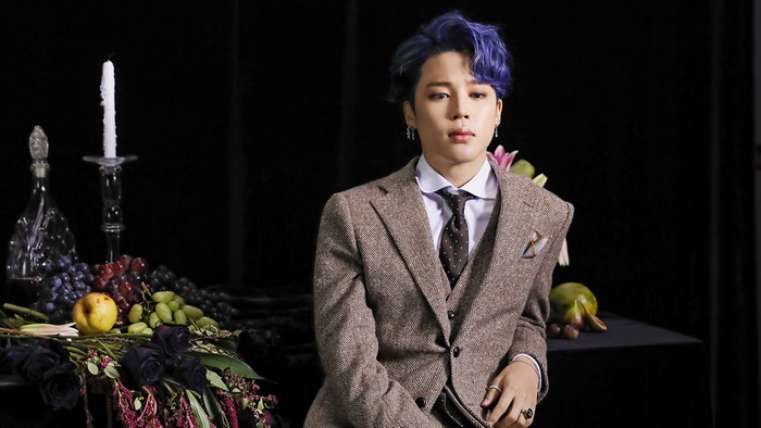 Jimin from BTS in a suit with blue hair