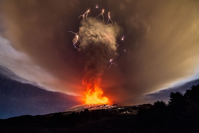 Volcanic eruption with lightning and smoke