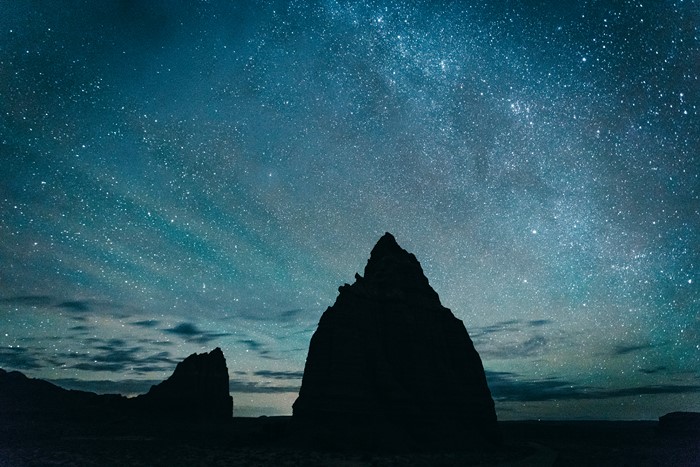 Starry Night Sky Over Rock Silhouettes