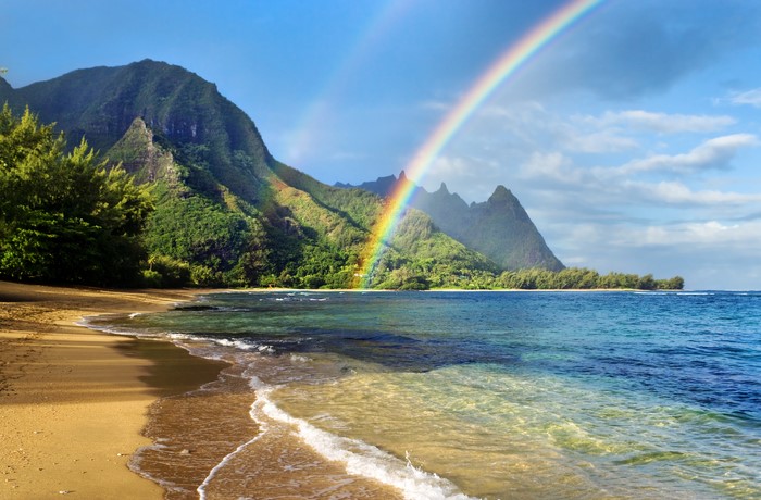 Beach with Mountains and Rainbow