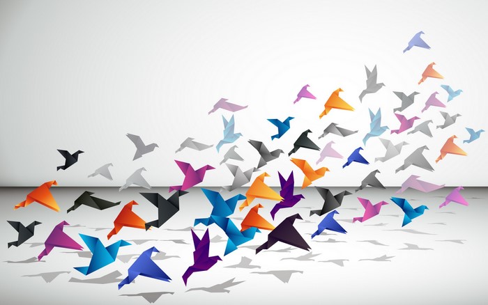 Origami birds flying in formation