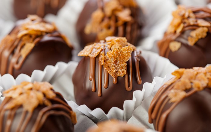 Chocolate truffles with caramel drizzle and nuts