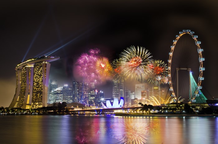 Singapore skyline with fireworks and Singapore Flyer