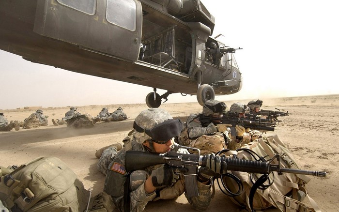Soldiers with M16 Rifles and M4 Carbines near a Helicopter