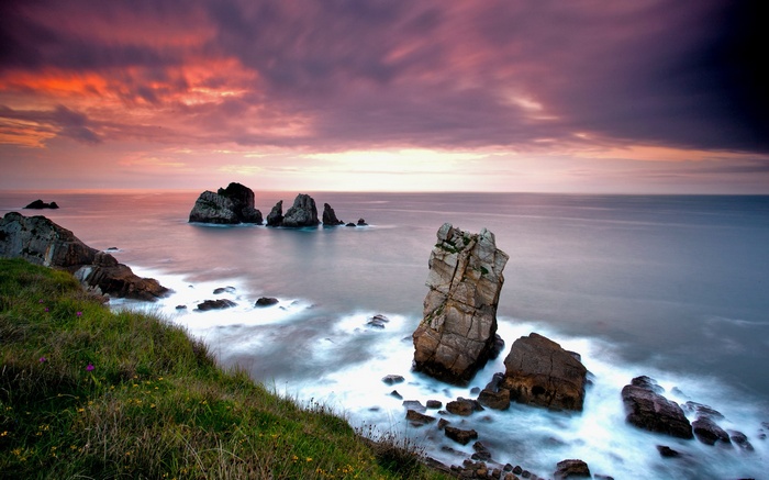 Rocky coastline with sea stacks at sunset