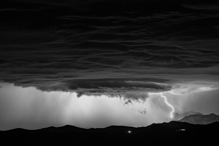 Black and White Lightning Storm Over Mountains