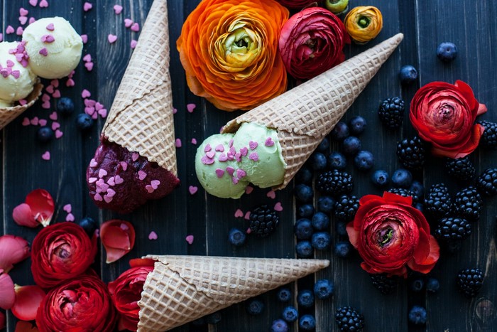 Ice cream cones with berries and flowers