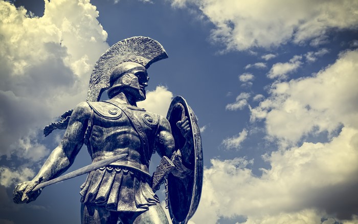 Statue of a Greek warrior with sword and shield