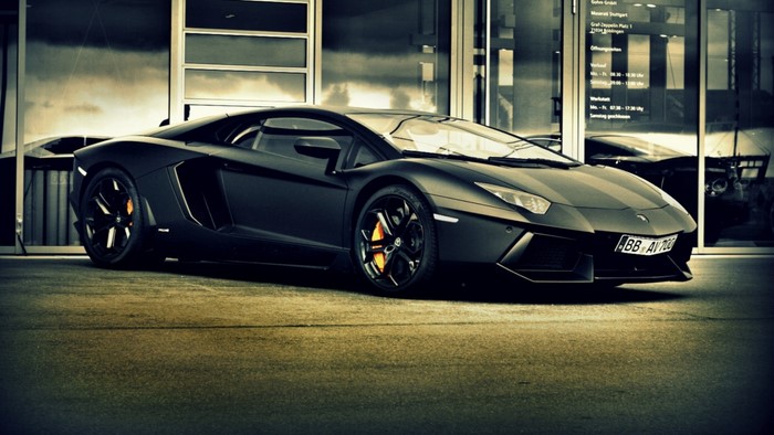 Black Lamborghini Aventador parked outside Maserati dealership
