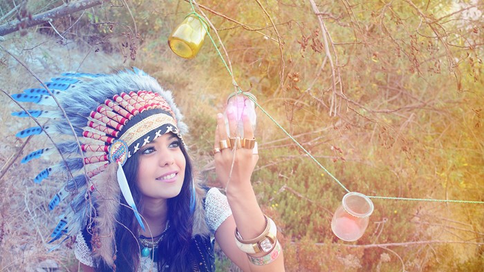 Woman in Native American Headdress with Jars