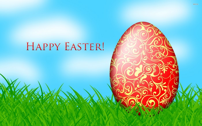 Happy Easter decorated egg in grass