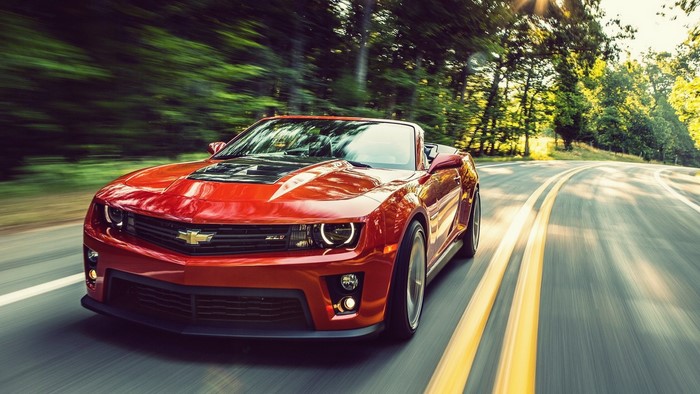 Red Chevrolet Camaro ZL1 Convertible Driving on a Winding Road