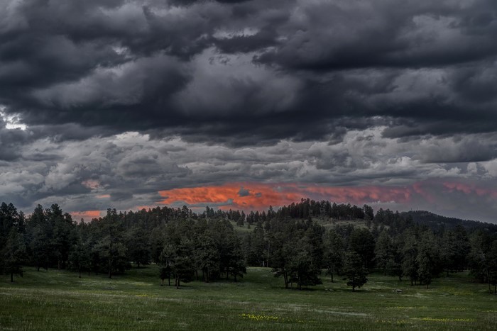 Stormy Sky Over Forested Hills
