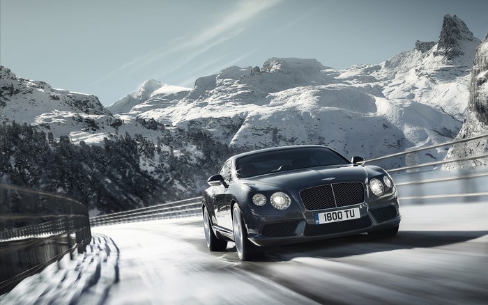 Bentley Continental driving on a snowy mountain road