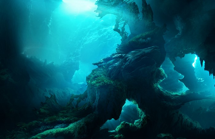 Underwater cave with blue light and rock formations