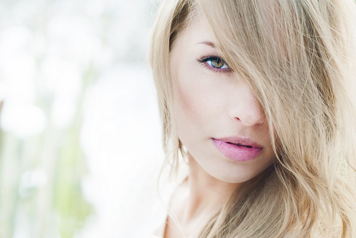 Beautiful blonde girl with pink lips
