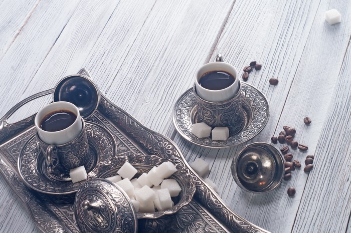 Turkish coffee set with sugar cubes and coffee beans
