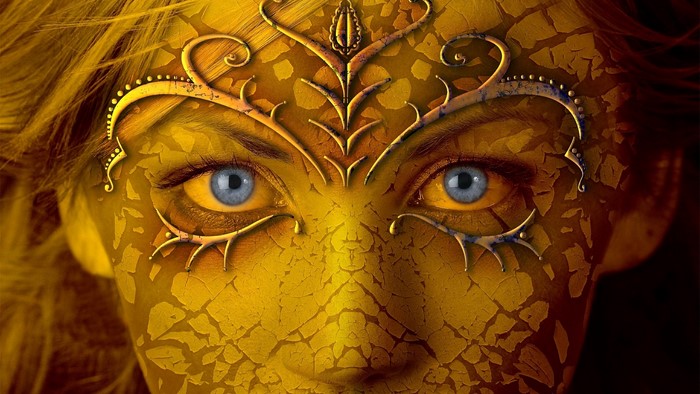 Woman with golden cracked face and blue eyes