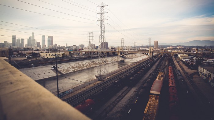 Los Angeles cityscape with railway and river