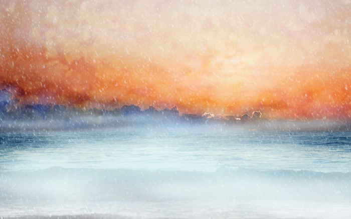 Sea and sky with pastel sunrise and snow