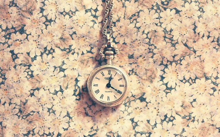 Pocket watch on floral fabric