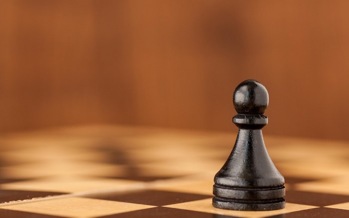 Black pawn on a chessboard