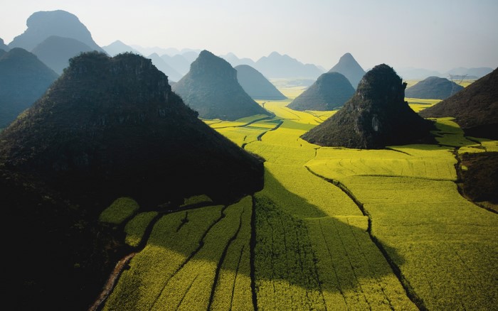 Karst mountains and yellow rapeseed fields