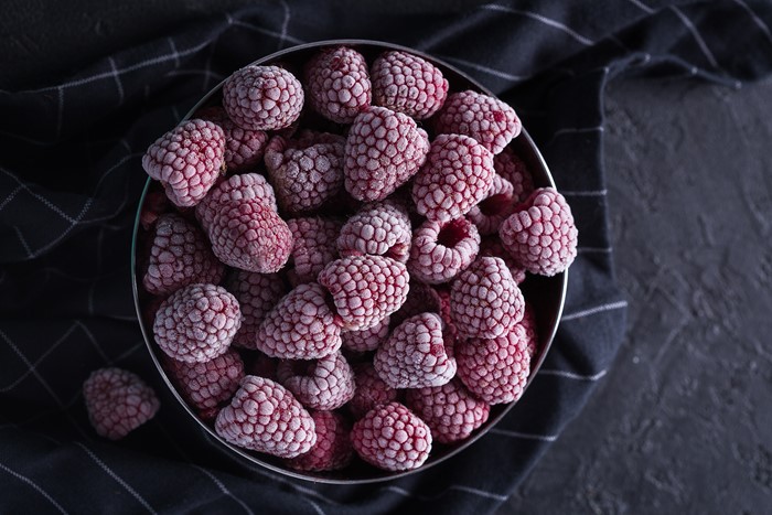 Frozen raspberries in a bowl