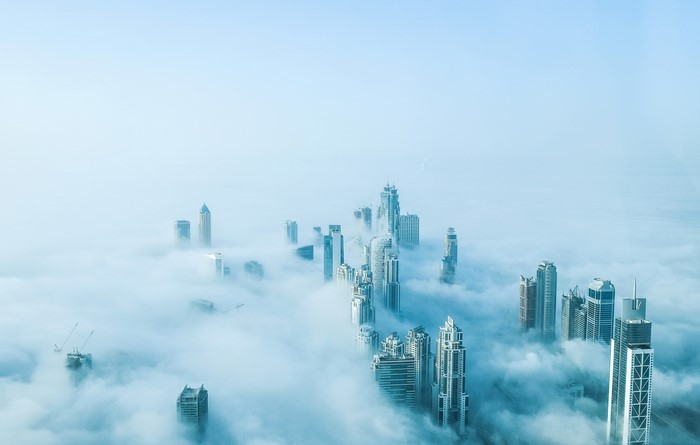Dubai skyscrapers emerging from fog