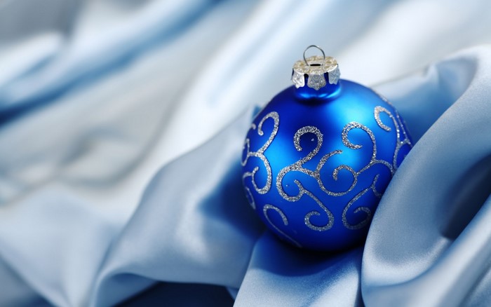 Blue Christmas ornament on blue silk
