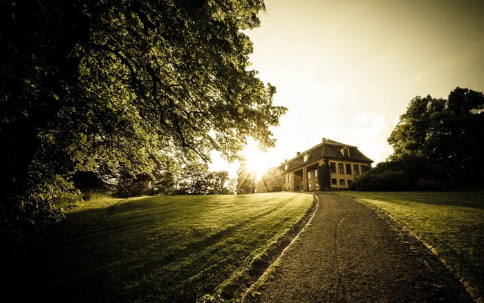 Mansion on a hill with a pathway