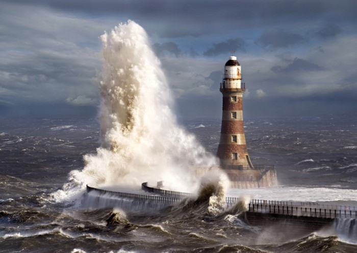 Stormy Seas Crash Against a Lighthouse
