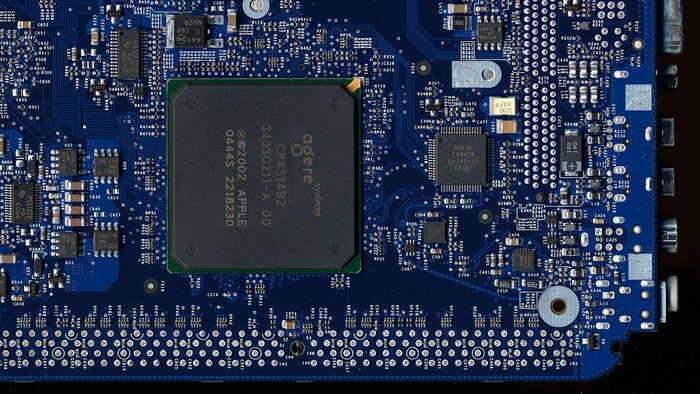 Close-up of a blue circuit board with a large processor