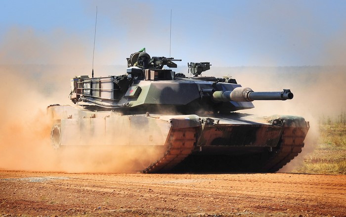 M1 Abrams tank in dust cloud