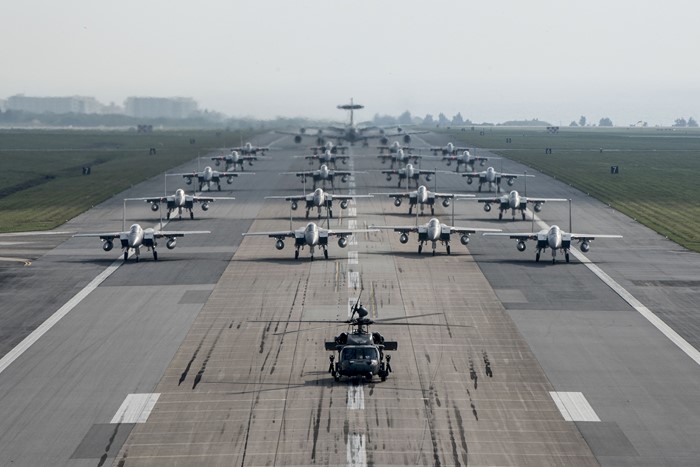 F-15 Eagles and HH-60 Pave Hawk on runway